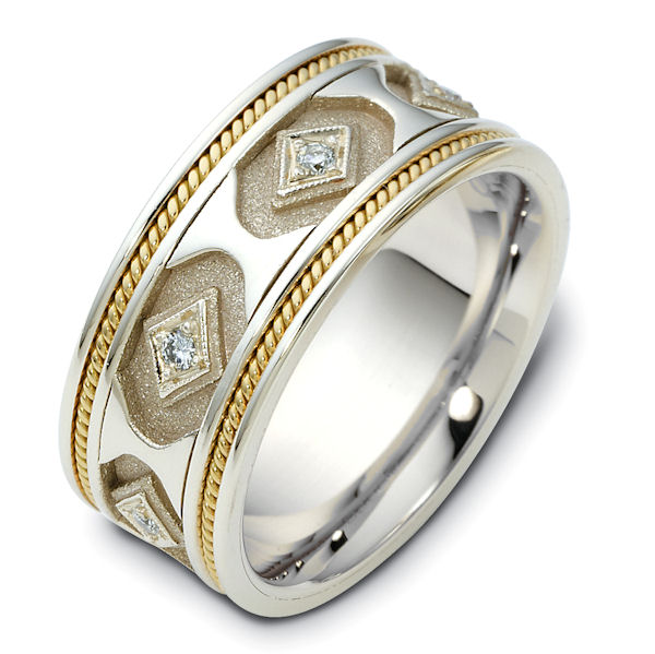 Item # 122281E - 18 K white, yellow or two tone, 8.5 mm wide, hand made diamond ring. Diamond total weight is approximately 0.14 ct in size 6.0. Diamonds are VS1-2 in clarity G-H in color. There are one handcrafted rope on each side of the ring. The grooves have a coarse and heavy sandblast finish. The rest of the ring has a polished finish. Different finishes may be selected or specified. 