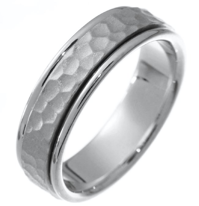Item # 211121W - 14Kt White gold hammered wedding band. The ring is about 6.5 mm wide and comfort fit. The hammered portion of the ring is a matte finish and the outer edges are polished. Different finishes may be selected or specified. 
