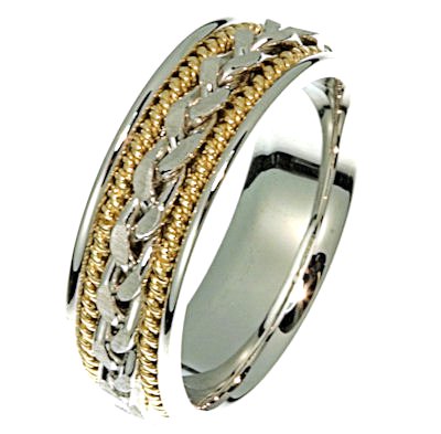 Item # 21397E - Hand crafted, 18kt two-tone gold comfort fit band. There is a hand made braid in the center. Two channels of 14 kt yellow gold twisted wires completes the ring. The whole ring is polished. Different finishes may be selected or specified.