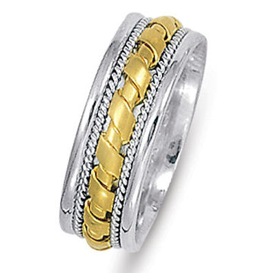Item # 21474E - Hand crafted, 18 kt two-tone gold comfort fit band. The ring is 7.0 mm wide. It has twisted white gold wires and accent of yellow gold. The yellow gold is matte and the white gold is polished finish.  Different finishes may be selected or specified.