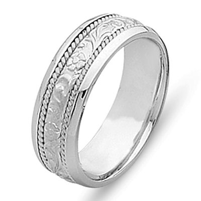 Item # 21491WE - 18 kt white gold hand carved, 6.0 mm wide comfort fit Celtic wedding band. The ring has hand carved 18 kt white gold designs and two twisted ropes made in 18 kt white gold. The center is matte finish and the rest is polished. Different finishes may be selected or specified. 