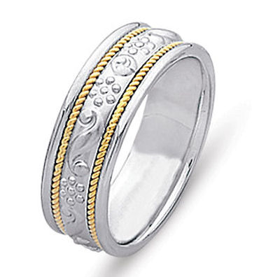 Item # 21494E - Hand crafted, 14 kt two-tone gold comfort fit band. Twisted 18 kt yellow gold wires and beautiful motifs crafted in the white gold. The center is matte and the rest is polished. Different finishes may be selected or specified. 