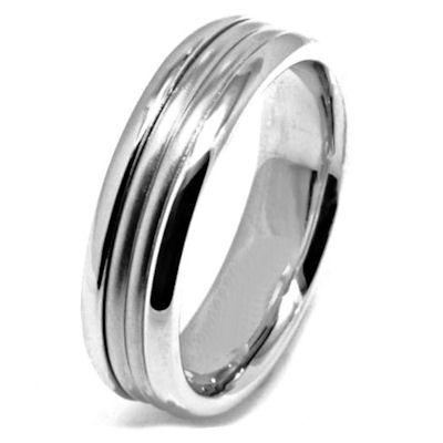 Item # 21524WE - 18 Kt white gold, hand crafted wedding band. The ring is 6.5 mm wide and comfort fit. The center of the ring is a matte finish and the outer edges are polished. Different finishes may be selected or specified.