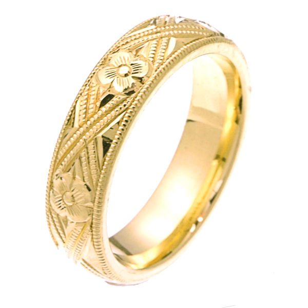 Item # 2228971E - 18 kt yellow gold hand carved comfort fit 5.0 mm wide wedding band. The yellow gold is hand carved with milgrains and flowers. It is 5.0 mm wide and a polished finish. Different finishes may be selected or specified. 