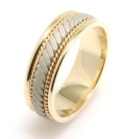 Item # 22470E - 18 K two tone, white and yellow gold, comfort fit, 7.0 mm wide, hand crafted wedding band. There is a hand made rope design in the center with one hand crafted rope on each side of the design. The finish in the center is a sandblasted matte and the outer edges are polished. Different finishes may be selected or specified.