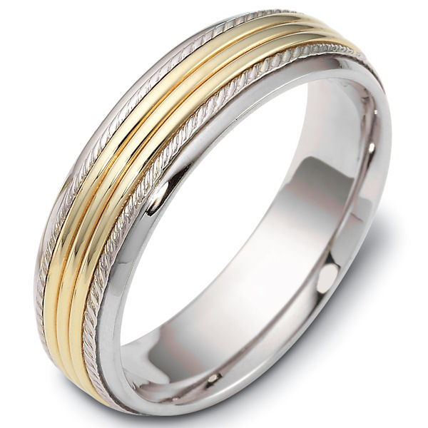 Item # 46833E - 18kt Two-tone gold classic, comfort fit, 6.0mm wide wedding band. The ring has carvings near the edges. It has a polished finish. Different finishes may be selected. 