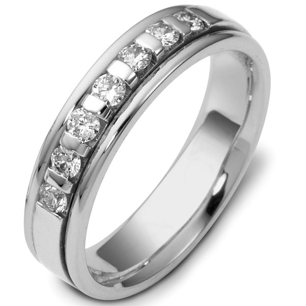 Item # 47243WE - 18kt White gold diamond, comfort fit, 4.5mm wide wedding band. The ring has approximately 0.28 ct tw diamonds, VS1-2 in clarity and G-H in color. There are 7 round brilliant cut diamonds and each measures about 0.04 ct. It is 4.5mm wide and comfort fit. The center is brushed and the rest of the ring is polished. Other finishes may be selected or specified.