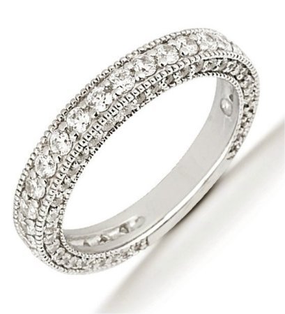 Item # 5412569PD - Palladium anniversary band. The ring holds 26 round brilliant cut diamonds that measures 2.0 mm, 2 round brilliant cut diamonds that measures 1.5 mm, 32 round brilliant cut diamonds that measures 1.3 mm, 28 round brilliant cut diamonds that measure 1.2 mm, and 12 round brilliant cut diamonds that measure 1.0 mm. The diamonds are approximately 1.40 ct tw, VS1-2 in clarity, very clean and G-H in color, near colorless to colorless.There are diamonds set both in the center of the band and on the sides with prongs. The band is about 3.5 mm wide.