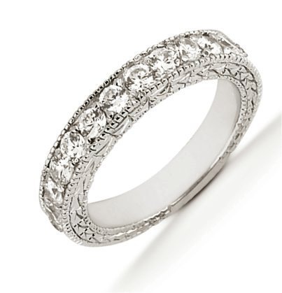 Item # 543959PD - Palladium anniversary band. The ring holds 11 round brilliant cut diamonds, each measures 1.8 mm. The diamonds are approximately 0.28 ct tw, VS1-2 in clarity, very clean and G-H in color, near colorless to colorless. The ring has a carved design and the diamonds are set in prongs. The band is about 3.5 mm. 