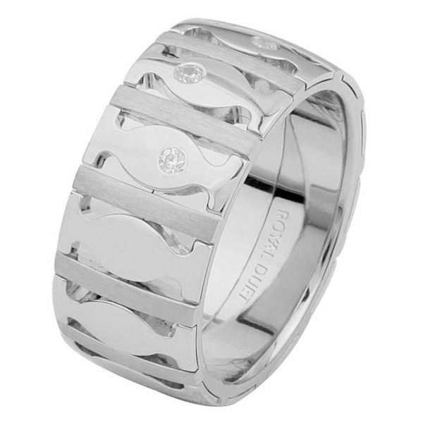 Item # 6871512DW - 14 kt white gold, comfort fit, 9.15 mm wide, wedding ring. The band combines the white gold to create a unique design with diamonds set into the ring. It has approximately 0.10 ct tw brilliant cut round diamonds, that are VS1-2 in clarity and G-H in color. There is a mixture of brushed and polished finishes on the ring. 