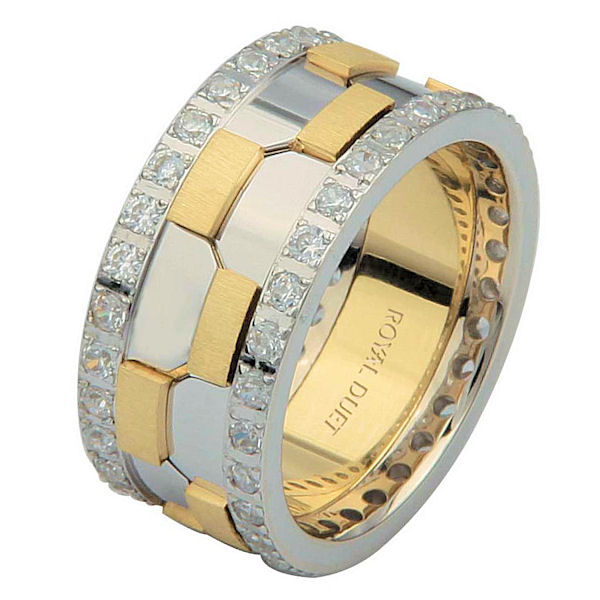 Item # 68740010DE - 18 kt two-tone gold, comfort fit, 9.3 mm wide, diamond eternity wedding ring. The band has a beautiful design with white and yellow gold. There are diamonds set around the whole band on each side. It has approximately 1.05 ct tw round brilliant cut diamonds, that are VS1-2 in clarity and G-H in color. The total weight of diamonds may vary depending on the size of the ring. 