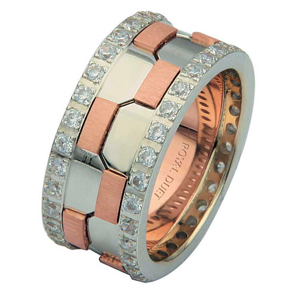 Item # 68740020DRE - 18 kt rose and white gold, comfort fit, 9.3 mm wide, diamond eternity wedding ring. The band has a beautiful design with white and rose gold together. There are diamonds set around the whole ring on each side. It has approximately 1.05 ct tw round brilliant cut diamonds, that are VS1-2 in clarity and G-H in color. The total weight of diamonds may vary depending on the size of the ring. 