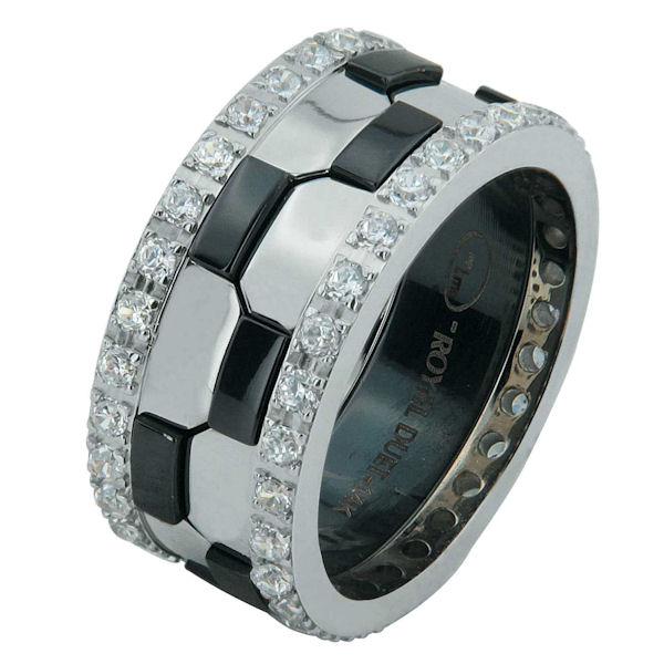Item # 68740030DW - 14 kt white gold and black rhodium, comfort fit, 9.3 mm wide, diamond eternity wedding ring. The band has a beautiful design of white gold with black rhodium on the ring. There are diamonds set around the whole ring on each side. It has approximately 1.05 ct tw round brililant cut diamonds, that are VS1-2 in clarity and G-H in color. The total weight of the diamonds may vary depending on the ring size. 