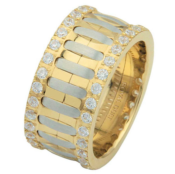 Item # 6874810D - 14 kt two-tone gold, comfort fit, 10.1 mm wide, diamond eternity ring. The band has a beautiful composition of white and yellow gold with diamonds accenting each side of the ring. It has approximately 1.05 ct tw round brilliant cut diamonds, that are VS1-2 in clarity and G- H in color. Diamond total weight may vary depending on the size of the ring. 