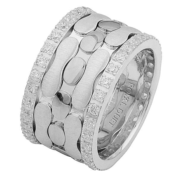 Item # 68749102DW - 14 kt white gold, comfort fit, 12.0 mm wide, diamond eternity ring. The band has a unique design made with white gold with diamonds accenting the ring on each side. It has approximately 1.05 ct tw round brilliant cut diamonds, that are VS1-2 in clarity and G-H in color. Diamond total weight may vary depending on the size of the ring. 