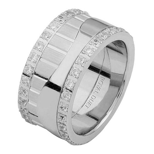 Item # 68752010DWE - 18 kt white gold, comfort fit, 10.2 mm wide, diamond eternity ring. The band has beautiful design made with white gold and diamonds accenting each side of the ring. It has about 1.05 ct tw round brilliant cut diamonds, that are VS1-2 in clarity and G-H in color. Diamond total weight may vary depending on the size of the ring. 