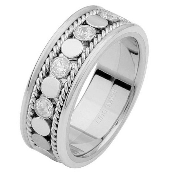 Item # 687631020DW - 14 kt white gold, 6.9 mm wide, comfort fit, diamond eternity ring. The band has a beautiful design made with white gold and diamonds set down the center. There are hand crafted ropes in the ring. The ring has about 0.28 ct tw round brilliant cut diamonds, that are VS1-2 in clarity and G-H in color. 