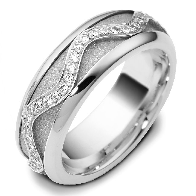 Item # A7769WE - 18K white gold, 7.0mm wide, comfort fit diamond wedding band. the center part is rotating. Diamond total weight is 0.30ct in size 6.0. The diamonds are graded as VS in Clarity and G-H in color.