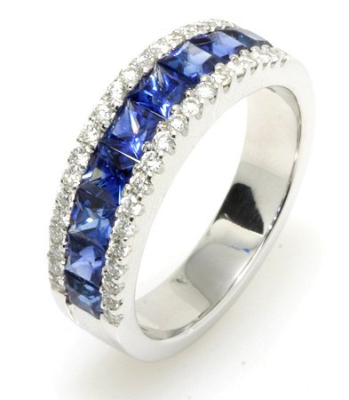 Item # E245067WE - 18K white gold, diamond blue sapphire, 6.0 mm wide anniversary band. The ring holds 9 square cut sapphires with total weight of 1.58 ct and 38 round brilliant cut diamonds with total weight of 0.33 ct. The diamonds are graded as VS in clarity G-H in color. The finish on the ring is polished. Other finishes may be selected or specified.