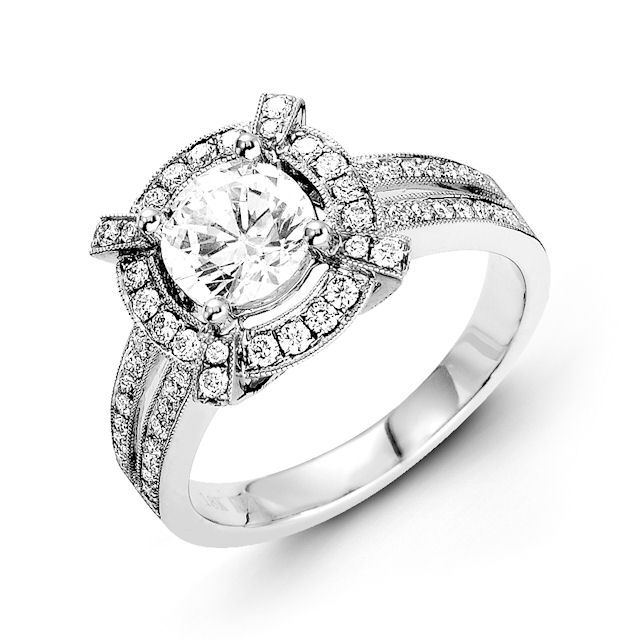 Item # E31946WE - 18kt white gold, halo, vintage diamond engagement ring. There are about 72 round brilliant cut diamonds set in the ring. The diamonds are about 0.54 ct tw, VS1-2 in clarity and G-H in color. Center stone is sold separately and in different sizes. Pictured is a 1.0 carat diamond. 