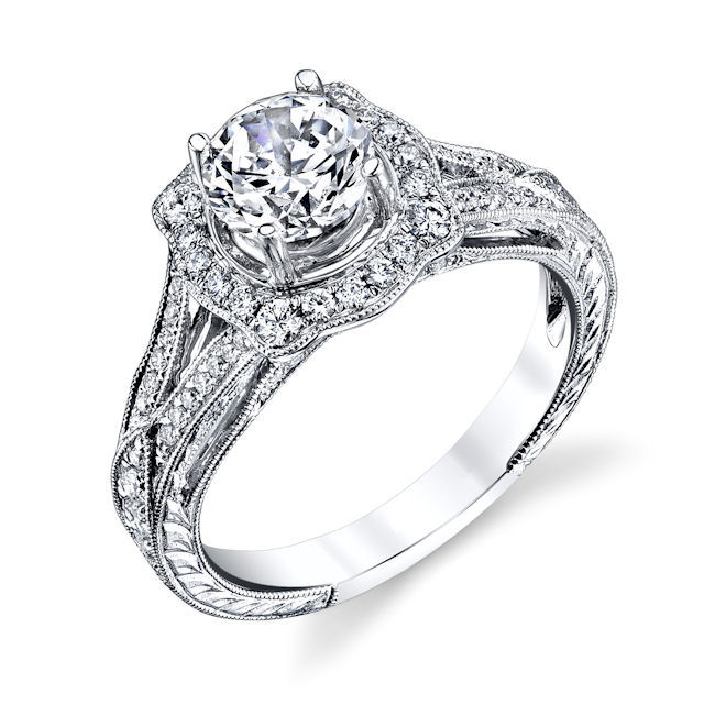 Item # E33044WE - 18kt white gold, vintage, halo diamond engagement ring. There are about 82 round brilliant cut diamonds set in the ring with 2 round brilliant cut genuine sapphires on the sides. The diamonds are about 0.51 ct tw, VS1-2 in clarity and G-H in color with 0.10 ct tw genuine sapphire. Center stone is sold separately and in different sizes. Pictured here is a 1.25 carat diamond. 