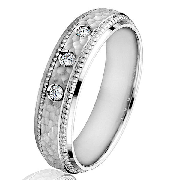 Item # G66767WE - 18kt white gold, hammered, diamond, comfort fit wedding ring. There are 3 round brilliant cut diamonds set in the ring. The diamonds are 0.09 ct tw, VS1-2 in clarity and G-H in color. The ring is 6.0 mm wide with a hammered finish in the center. 