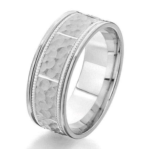 Item # G87135WE - 18kt white gold, 8.0 mm wide, hammered, comfort fit classic wedding ring. The center of the ring is a hammered brushed finish with milgrain accents in the ring and the edges are polished. Other finishes may be selected or specified or selected. The ring is 8.0 mm wide.  