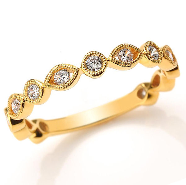 Item # M31888E - 18kt yellow gold diamond anniversary and stackable ring. There are about 13 round brilliant cut diamonds set in the ring. The diamonds are about 0.40 ct tw, VS1-2 in clarity and G-H in color. 