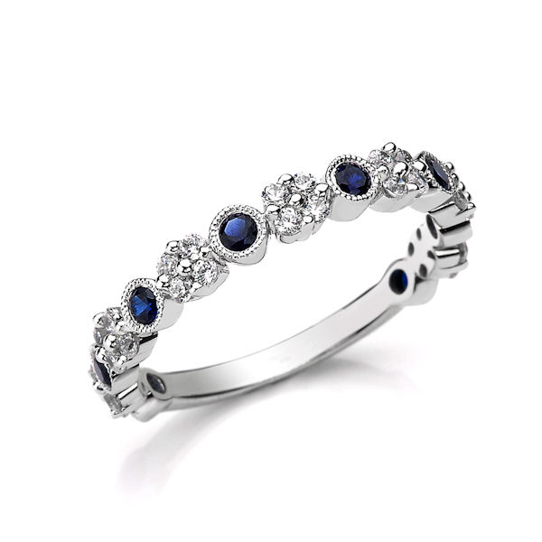 Item # M31954WE - 18kt white gold diamond & sapphire anniversary ring with milgrain design.  There are about 36 round brilliant cut diamonds and genuine blue sapphires set in the ring. The diamonds are about 0.30 ct tw, VS1-2 in clarity, G-H in color and about 0.37 ct tw genuine blue sapphires.  