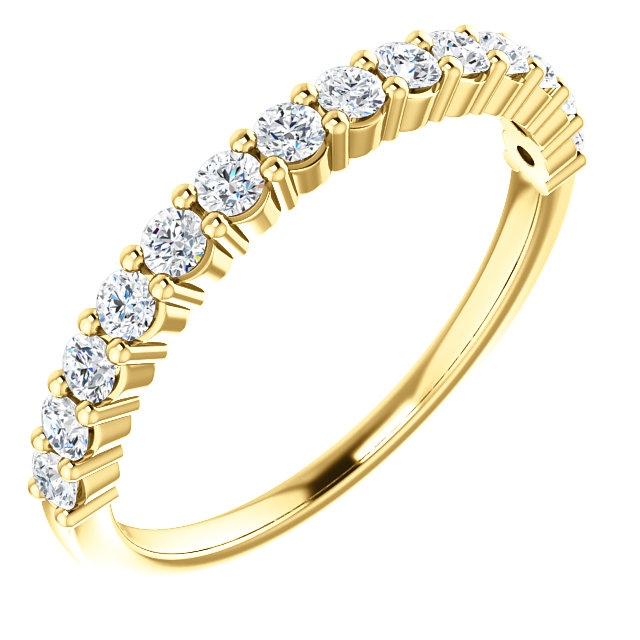 Item # SR128555050 - 14K gold, 14 diamonds anniversary band. The diamonds together weigh 0.5ct and are graded as SI1 in clarity G-H in color.